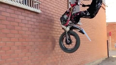 motorcycle climbing the wall