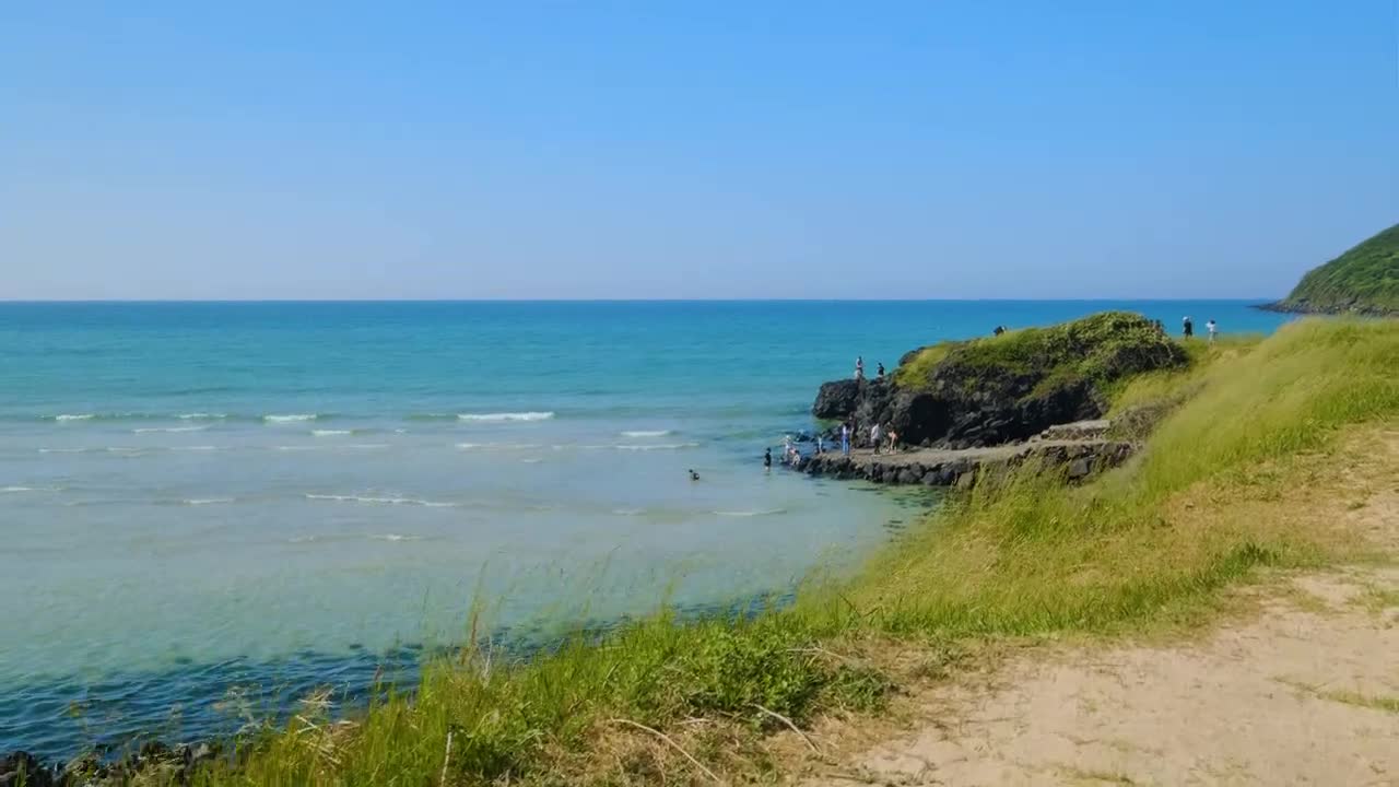 Walking on the beach in Jeju Island, South Korea. Hamdeok Beach