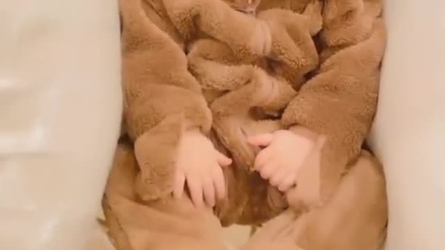 Cute baby wearing lion costume