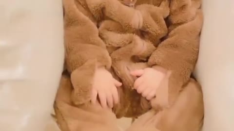 Cute baby wearing lion costume