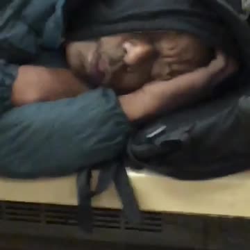 Guy sleeps with z,z,z emojis on new york subway