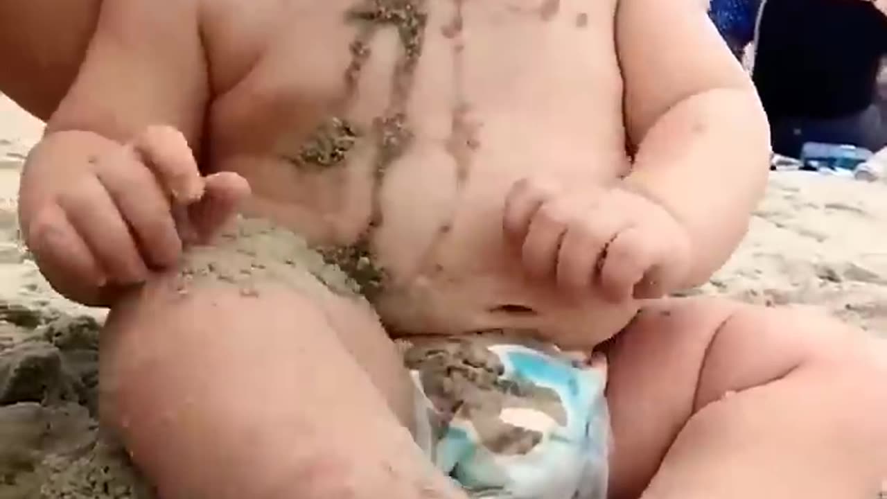 funny baby reaction on beach