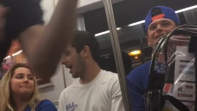 You gottem kid guy in black throws on subway train