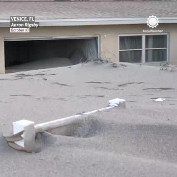 Homes along the coast in Venice, Florida, are buried in sand from Hurricane Milton.