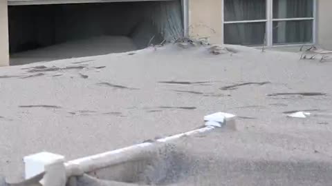 Homes along the coast in Venice, Florida, are buried in sand from Hurricane Milton.