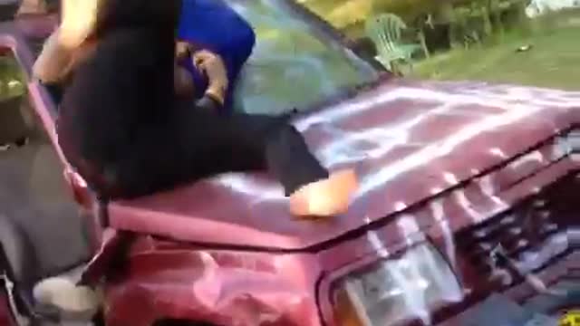 Man with blue shirt on head