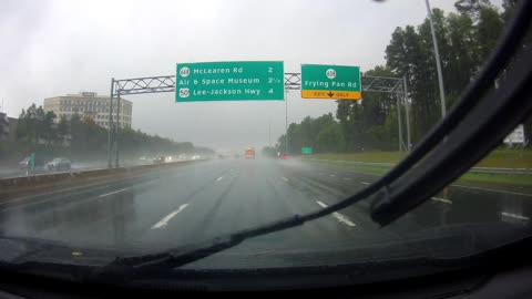 Truck Spins Out on Rainy Freeway