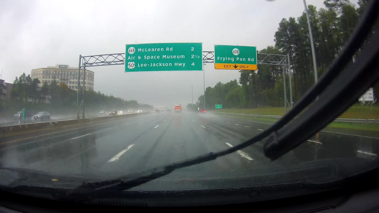 Truck Spins Out on Rainy Freeway