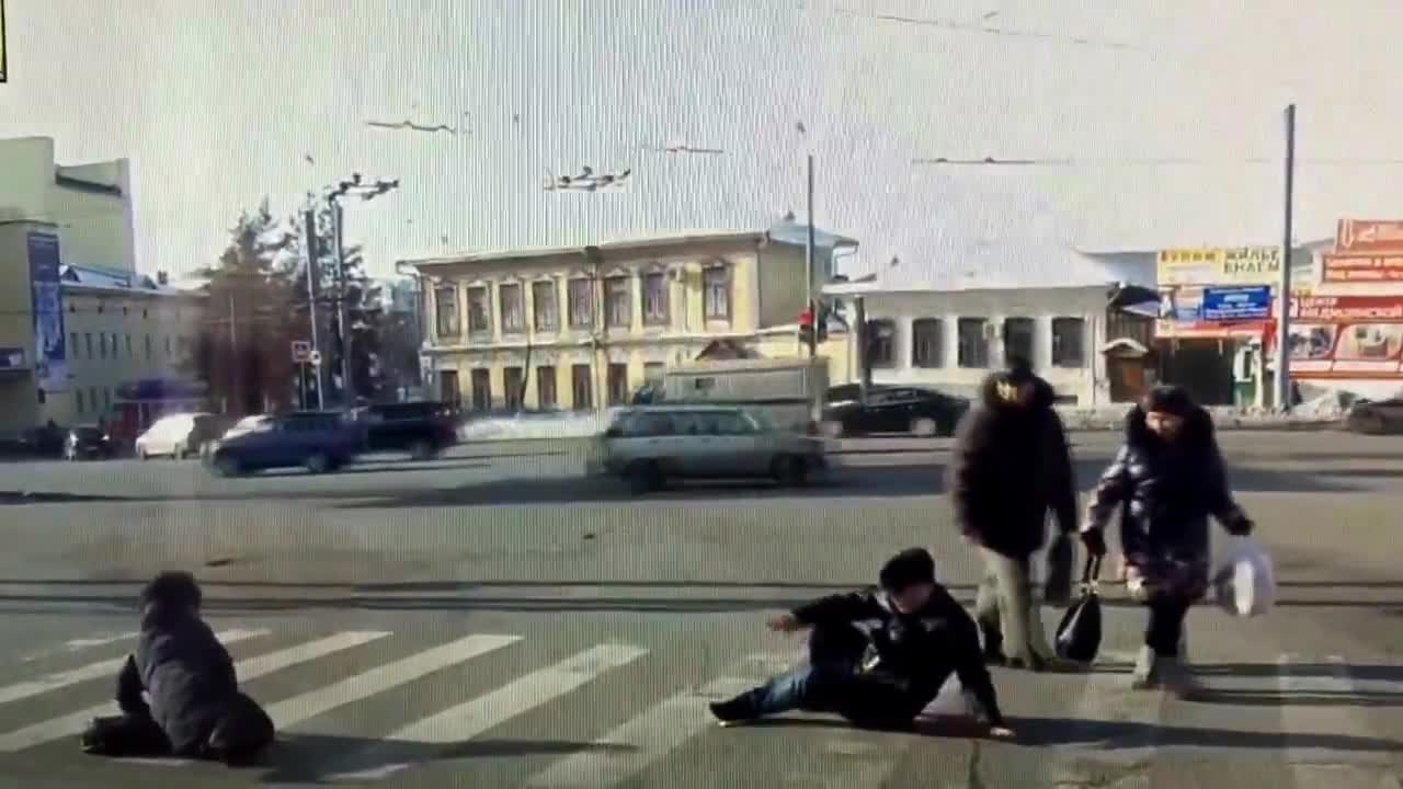 Strangers Trip Over Each Other While Crossing the Street