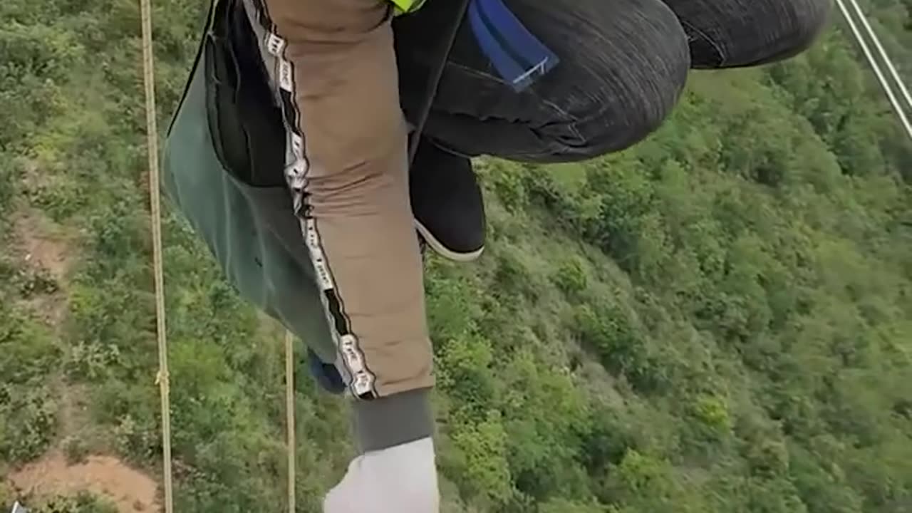 This electrician is equipped with safety tools while working at heights