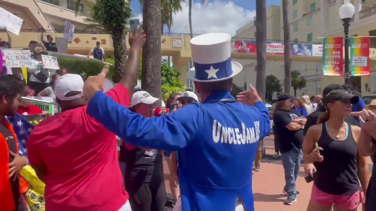 Protestors and Student Action Summit attendees clash outside the stamps Convention Center