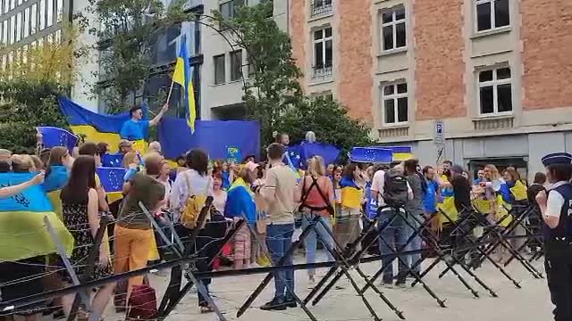 People gathered in front of the EU Council in support of granting candidate status to Ukraine