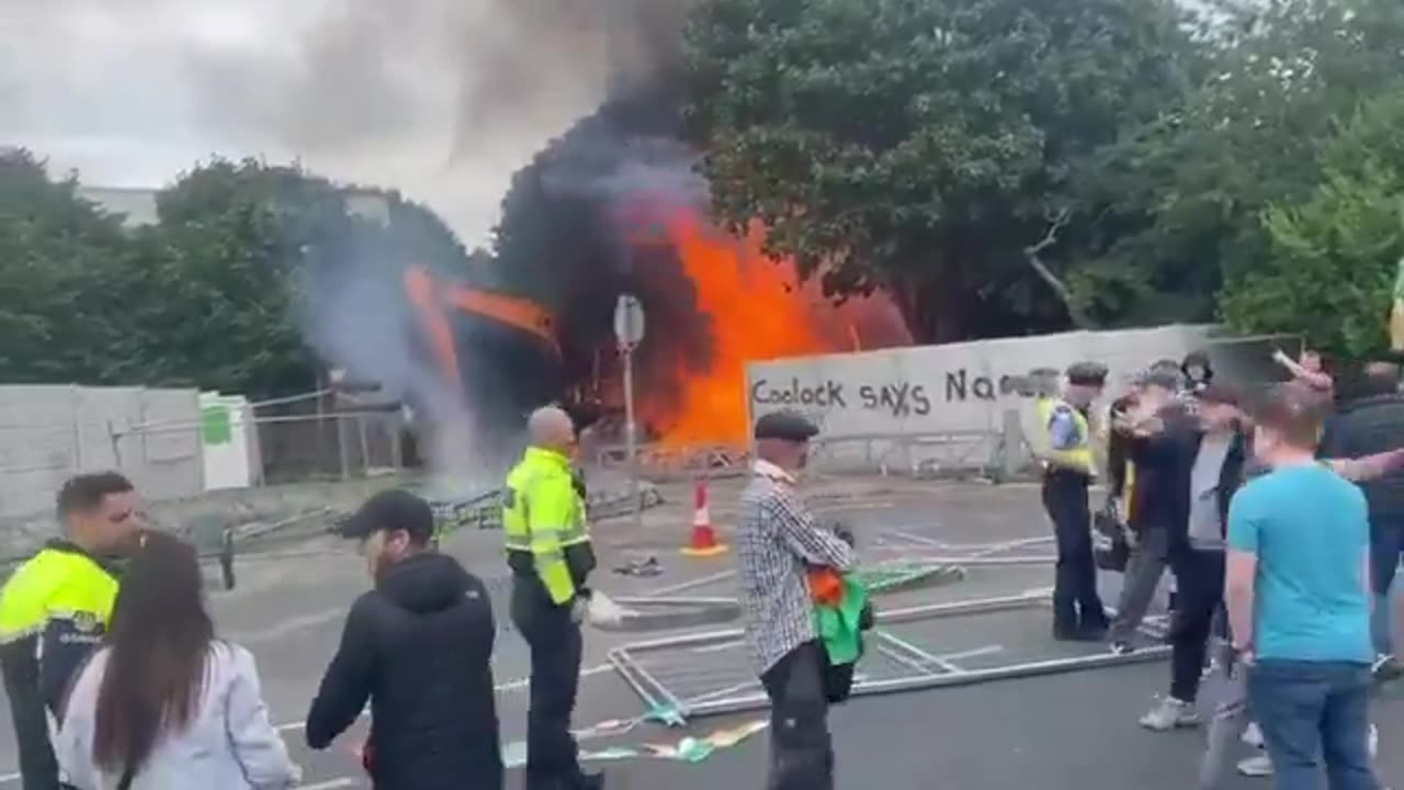 Irish people opposing immigration set construction worker equipment on fire