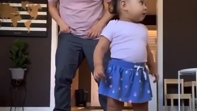 dad and daughter dance together