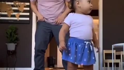 dad and daughter dance together