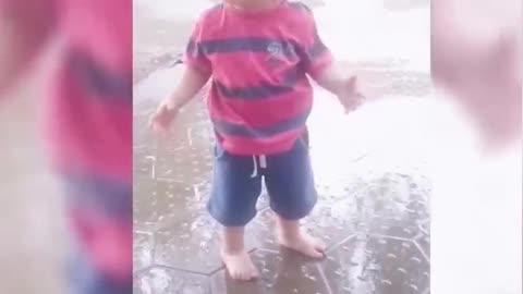 Baby standing in the rain