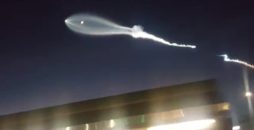 Rocket Launch Forms Bright Clouds in Night Sky