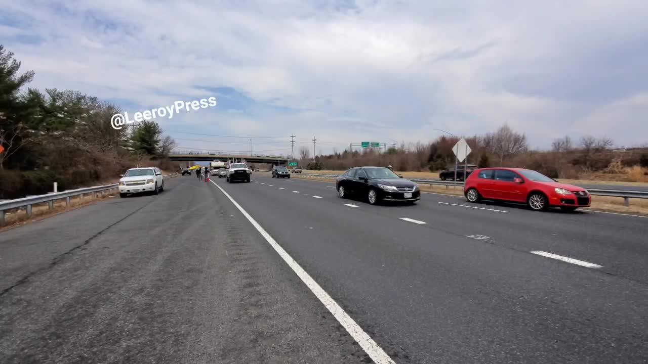 Massive line of cars and truckers from the people's convey making their way to Washington DC