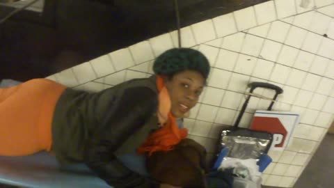 Luodong Massages Black Woman In Subway Station