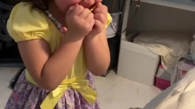 Little girl excitedly meets her newborn baby brother