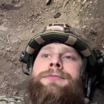 Azov militants film the arrival of a projectile at their position