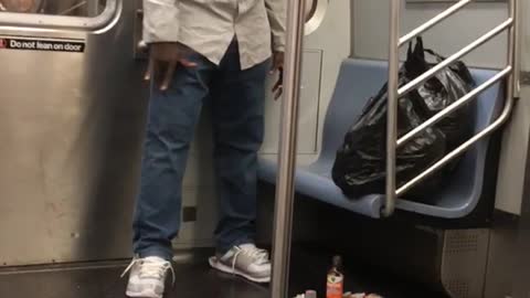 Man looking and talking to trash on floor