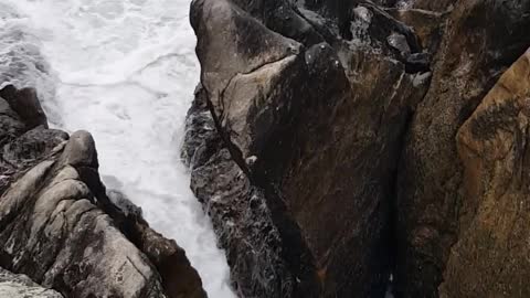 The appearance of the waves coming through the rocks