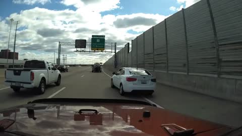 Impatient Car Swerves Through Traffic