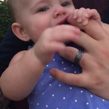 Baby makes funny noises at dad