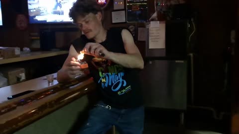 Man Nonchalantly Eats On Fire Chip