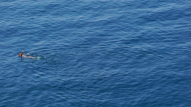 A woman swimming on the back