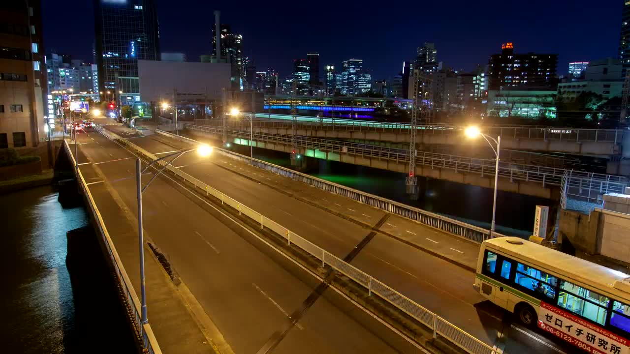 Small bridges over a canal in a city at night