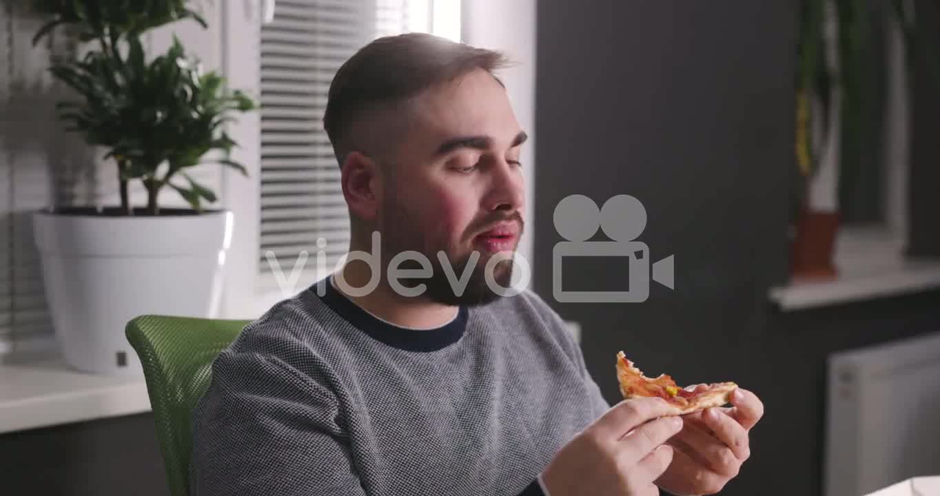 Hungry Man Having A Break And Eating Tasty Pizza At Office 3