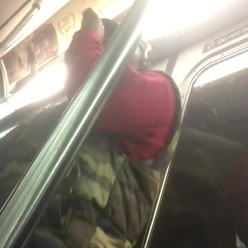 Camo vest guy sings acapella to self in subway
