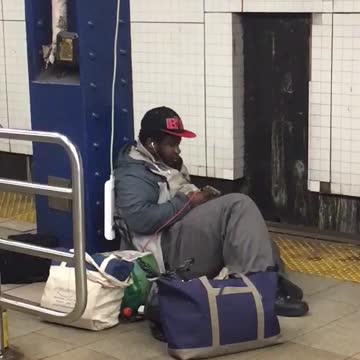 Man using outlet in subway