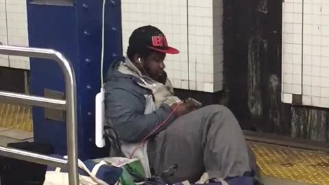 Man using outlet in subway