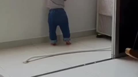 This Cat is protecting baby from potentially dangerous
