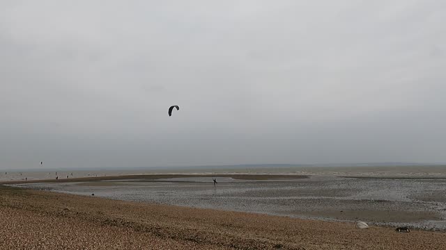 Kitesurfer priming their kite to kite surf