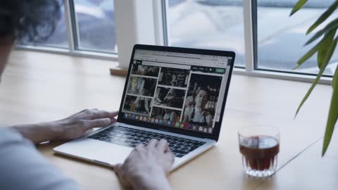 People surfing the internet while drinking coffee