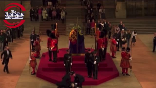 Royal guard suddenly collapses while guarding Queen Elizabeth II coffin.