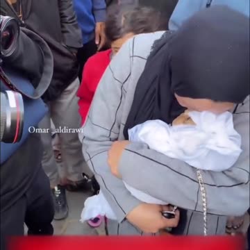 Plastic doll used in multiple Palestinian propaganda videos saying its a dead child