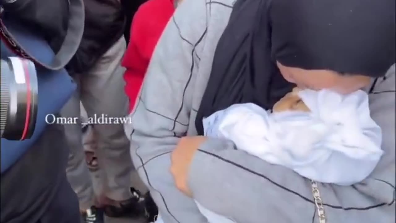 Plastic doll used in multiple Palestinian propaganda videos saying its a dead child
