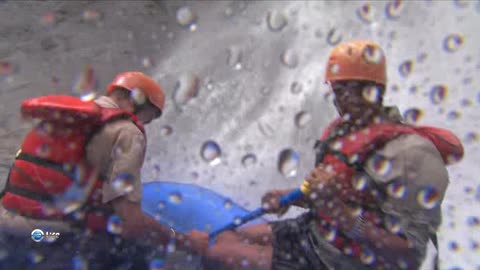 Swimming on inflatable boats on a tropical river