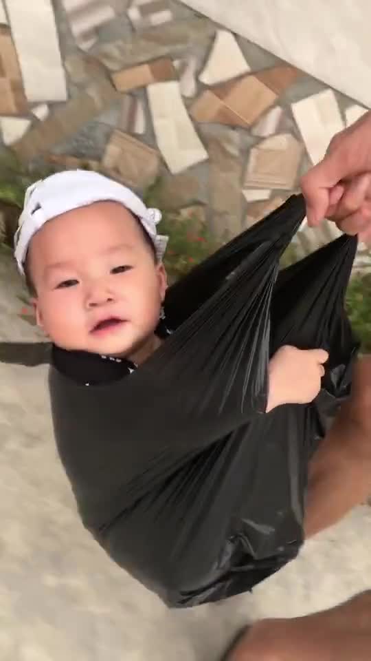 when the baby is taken to the market by his father.