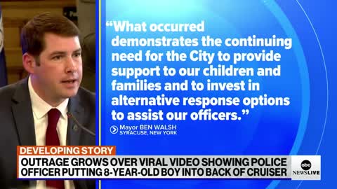 Fallout over viral video of police officer putting 8-year-old boy into back of c