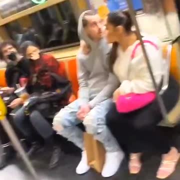 Door opens on Q train rolling over Manhattan Bridge