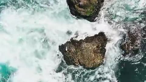 Birds Eye View of Crashing Waves on the Rock