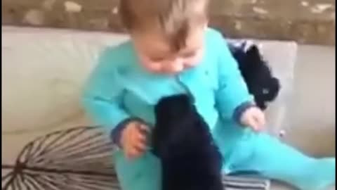 Baby playing with cute puppy