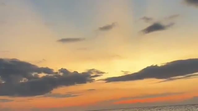 all waves jump, stirring up the lake full of broken gold