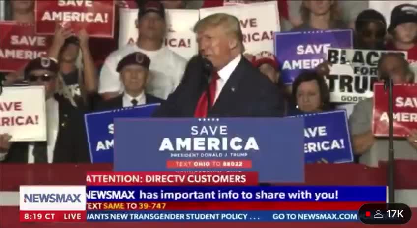 👀 Everyone in the front row of the crowd is holding up a "1" - while the WWG1WGA song plays in the background